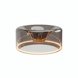 Żarówka LED donut E27 z przydymionego szkła, Ø 195 mm, włączona, ciepły pierścień światła, białe tło